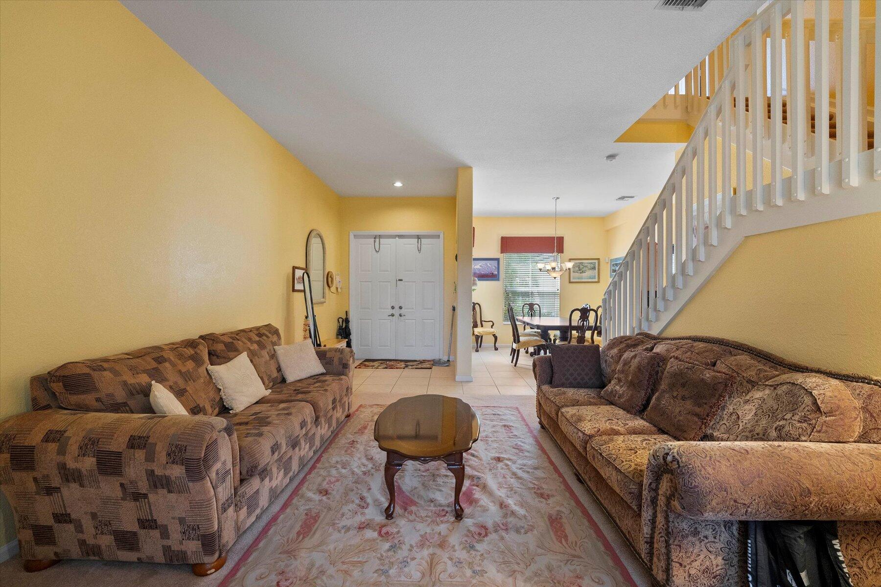 5002 Victoria Circle West Palm Beach, FL 33409 - Photo 5 of 37 a living room with furniture and a rug