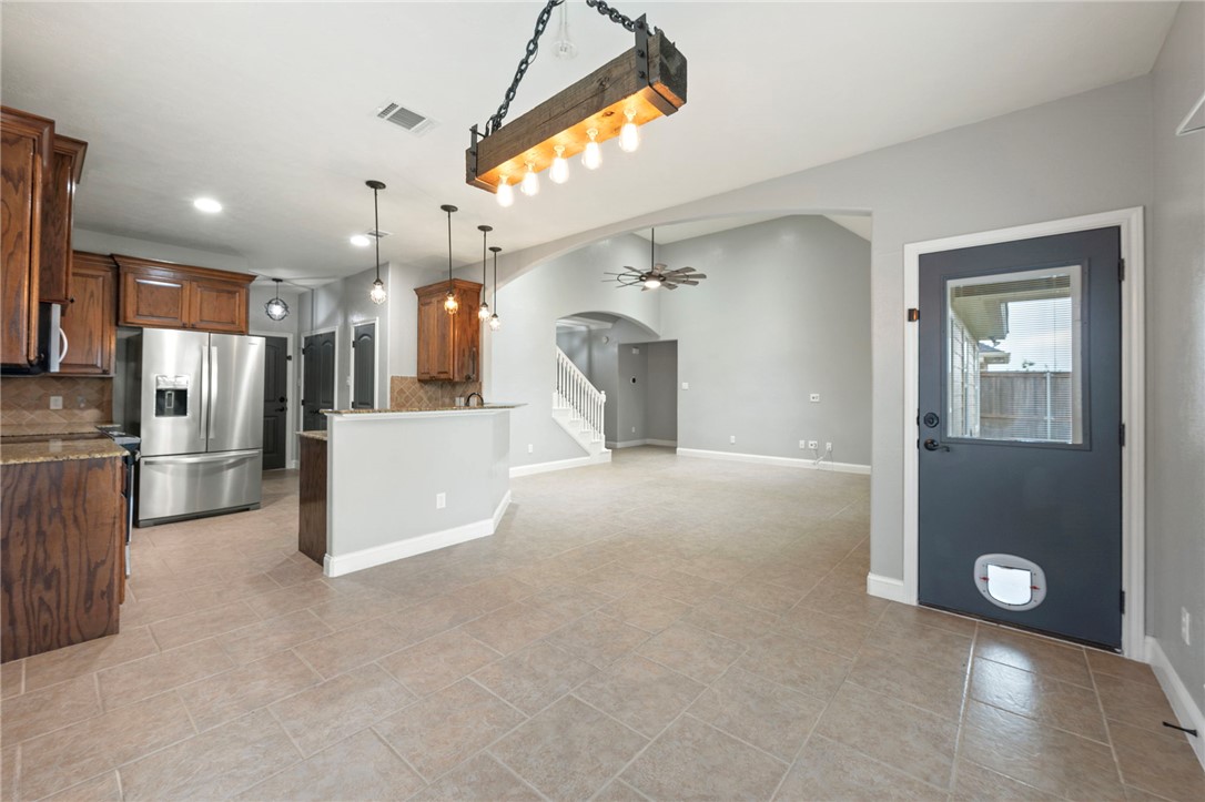 3304 Keefer Loop College Station, TX 77845 - Photo 8 of 21 a view of a kitchen with a refrigerator and a sink