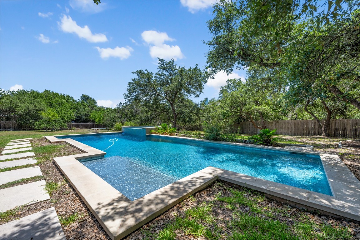 1405 Carlotta Lane Austin, TX 78733 - Photo 1 of 1 a view of a backyard with swimming pool