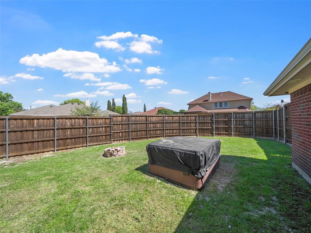 741 Aspen Court Allen, TX 75002 - Photo 5 of 40 Fenced backyard with an outdoor fire pit