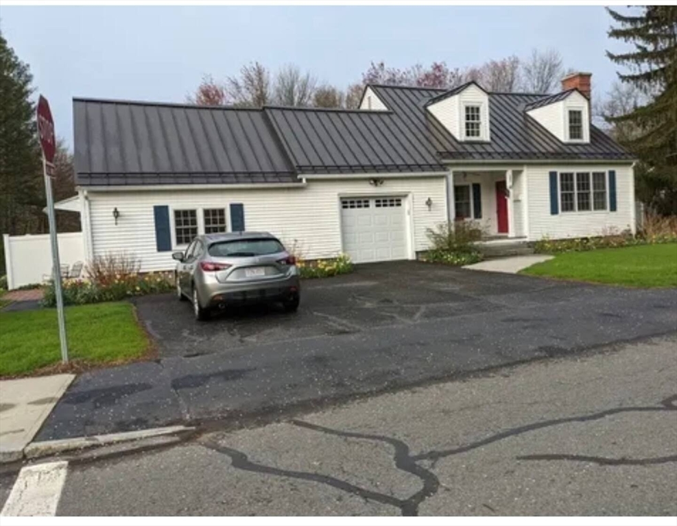 161 Chestnut Street Amherst, MA 01002 - Photo 1 of 41 a front view of a house with a garden