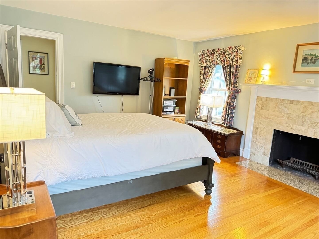 161 Chestnut Street Amherst, MA 01002 - Photo 21 of 41 a bedroom with a bed and a flat screen tv