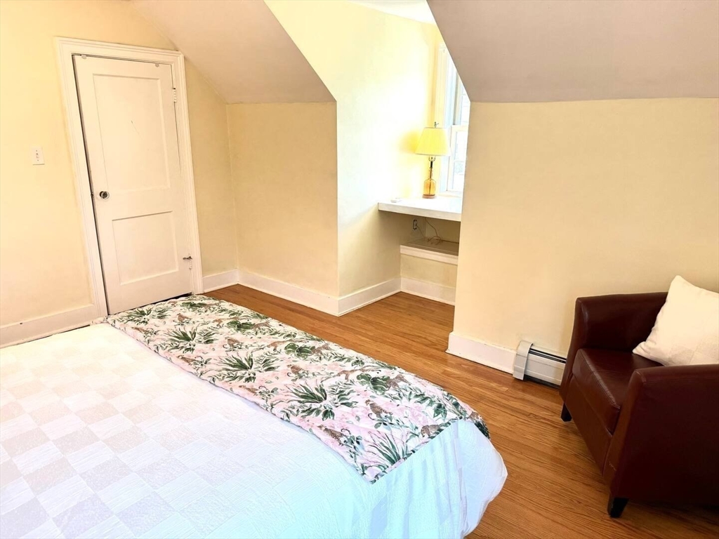 161 Chestnut Street Amherst, MA 01002 - Photo 23 of 41 a view of a bedroom with wooden floor and bathroom