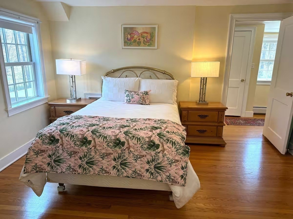 161 Chestnut Street Amherst, MA 01002 - Photo 25 of 41 a bedroom with a bed and wooden floor