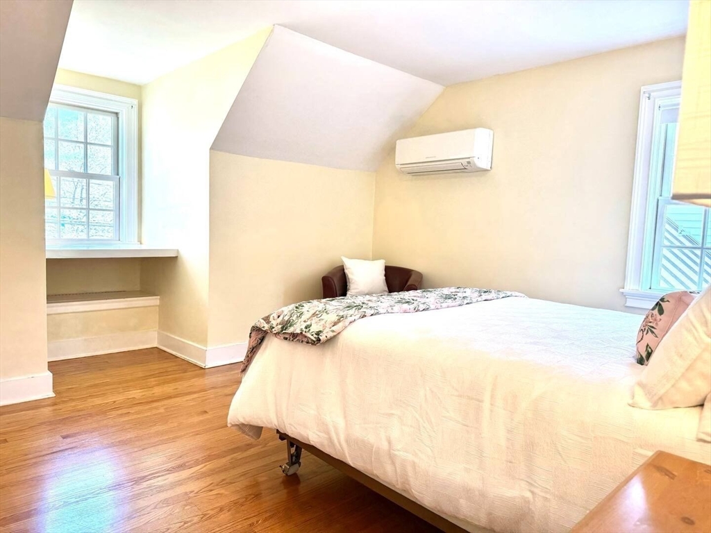 161 Chestnut Street Amherst, MA 01002 - Photo 27 of 41 a bedroom with a bed and wooden floor