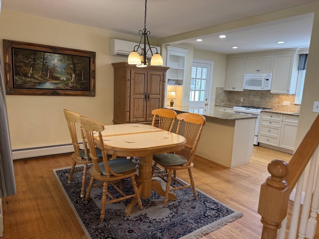 161 Chestnut Street Amherst, MA 01002 - Photo 32 of 41 a view of a dining room with furniture window and wooden floor