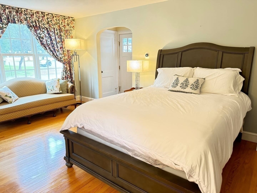 161 Chestnut Street Amherst, MA 01002 - Photo 6 of 41 a bedroom with a bed and a painting on the wall