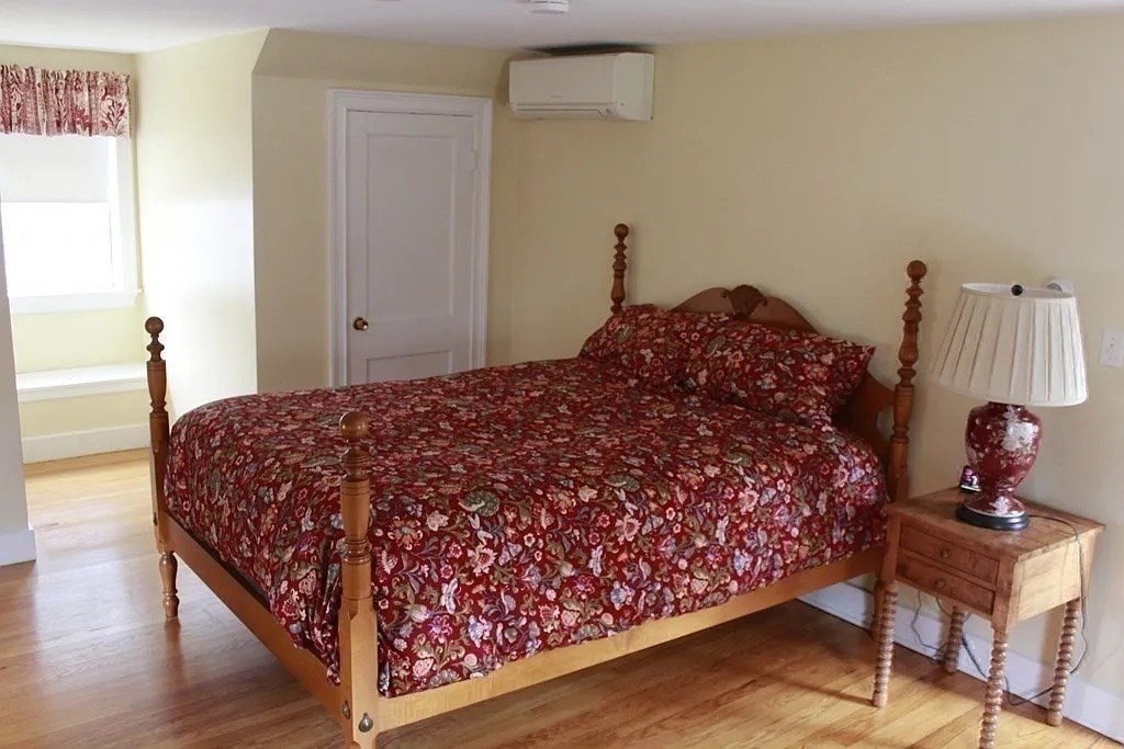 161 Chestnut Street Amherst, MA 01002 - Photo 7 of 41 a bed sitting in a bedroom next to a window