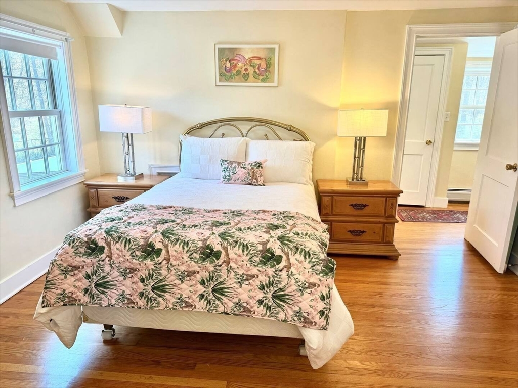 161 Chestnut Street Amherst, MA 01002 - Photo 9 of 41 a bedroom with a bed and wooden floor