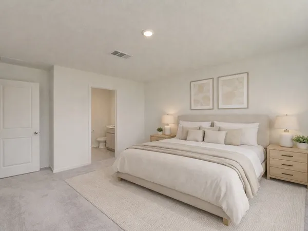 a bedroom with a bed and a night lamp