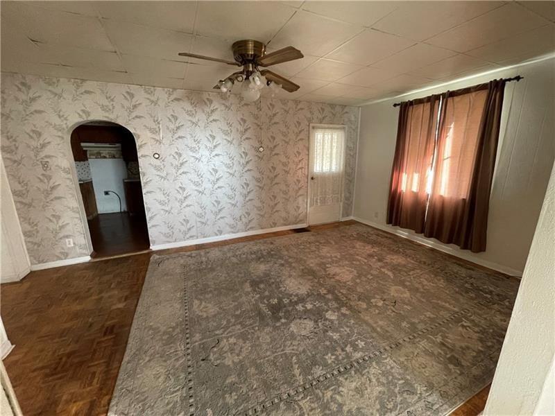 211 South Walnut Street New Castle, PA 16101 - Photo 17 of 18 wooden floor in an empty room with a window