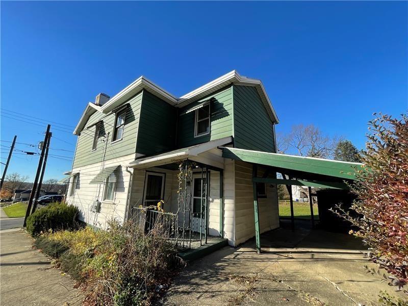 211 South Walnut Street New Castle, PA 16101 - Photo 2 of 18 a front view of a house with garden