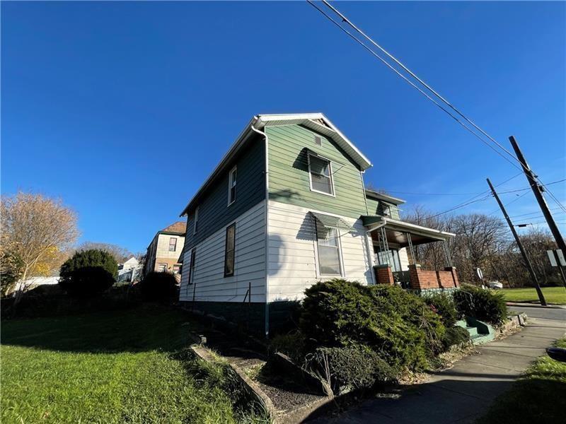 211 South Walnut Street New Castle, PA 16101 - Photo 3 of 18 a front view of a house with a yard