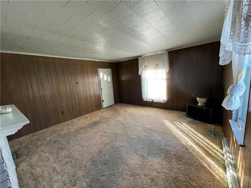 211 South Walnut Street New Castle, PA 16101 - Photo 5 of 18 a view of a livingroom with a fireplace