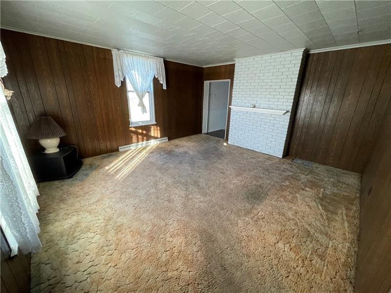 211 South Walnut Street New Castle, PA 16101 - Photo 6 of 18 a bedroom with a bed and wooden floor