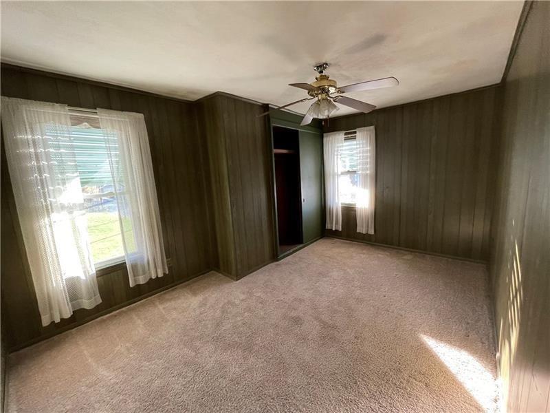 211 South Walnut Street New Castle, PA 16101 - Photo 8 of 18 a view of a livingroom with a ceiling fan and window