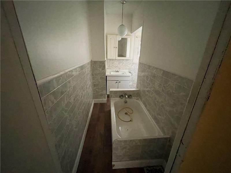 211 South Walnut Street New Castle, PA 16101 - Photo 10 of 18 view of a bathroom with sink and mirror