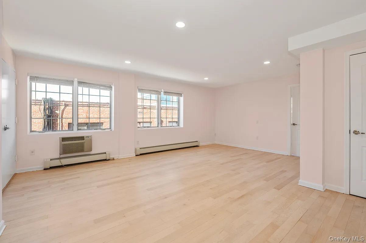 32-86 41st Street, Unit 3F Queens, NY 11103 - Photo 4 of 9 a view of an empty room with a window