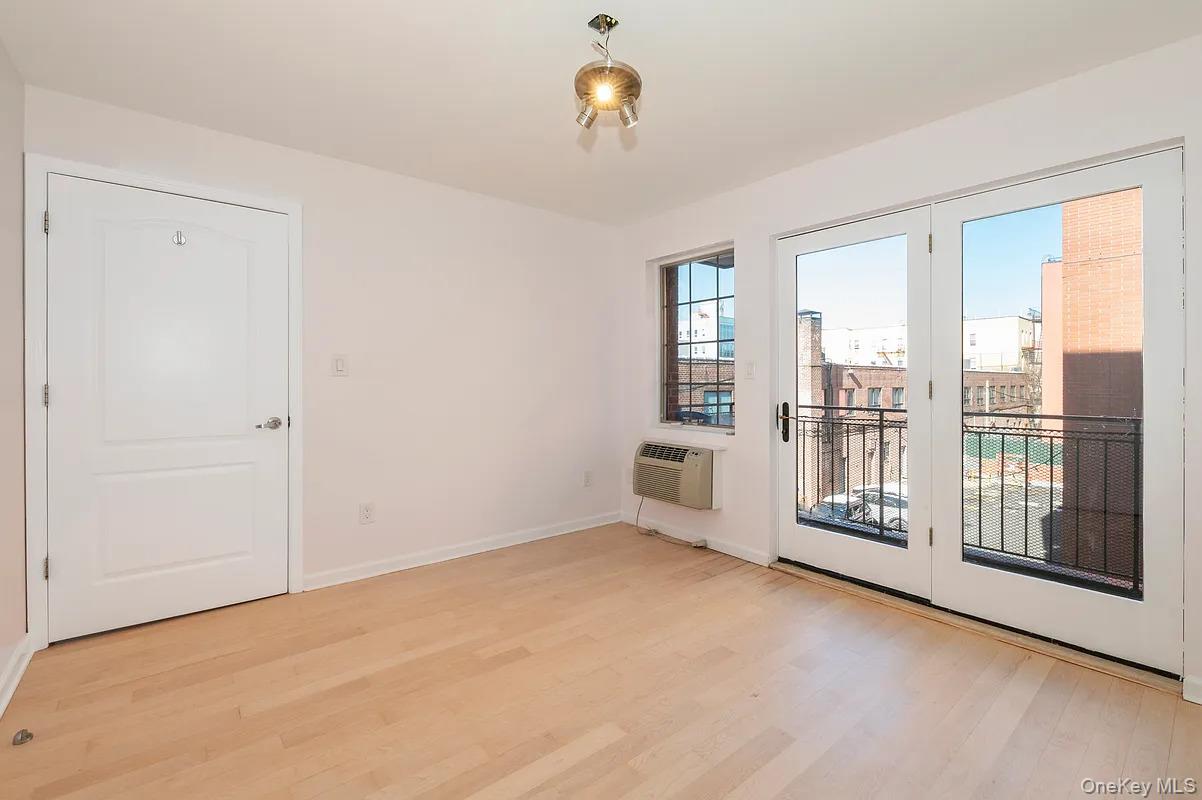 32-86 41st Street, Unit 3F Queens, NY 11103 - Photo 5 of 9 a view of an empty room with a window