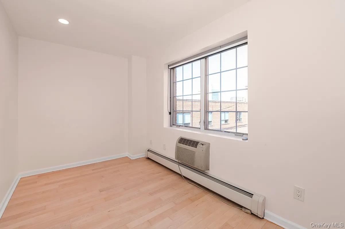 32-86 41st Street, Unit 3F Queens, NY 11103 - Photo 6 of 9 an empty room with windows