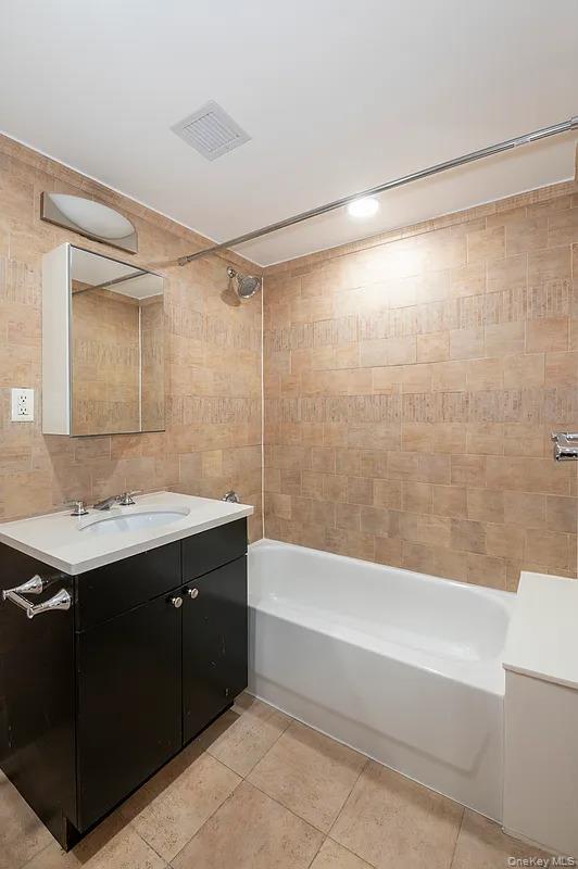 32-86 41st Street, Unit 3F Queens, NY 11103 - Photo 7 of 9 a bathroom with a sink and a mirror