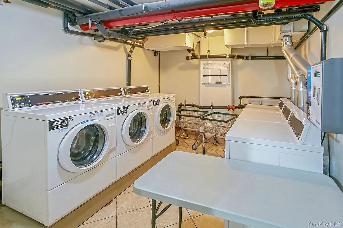 32-86 41st Street, Unit 3F Queens, NY 11103 - Photo 9 of 9 a utility room with dryer and washer