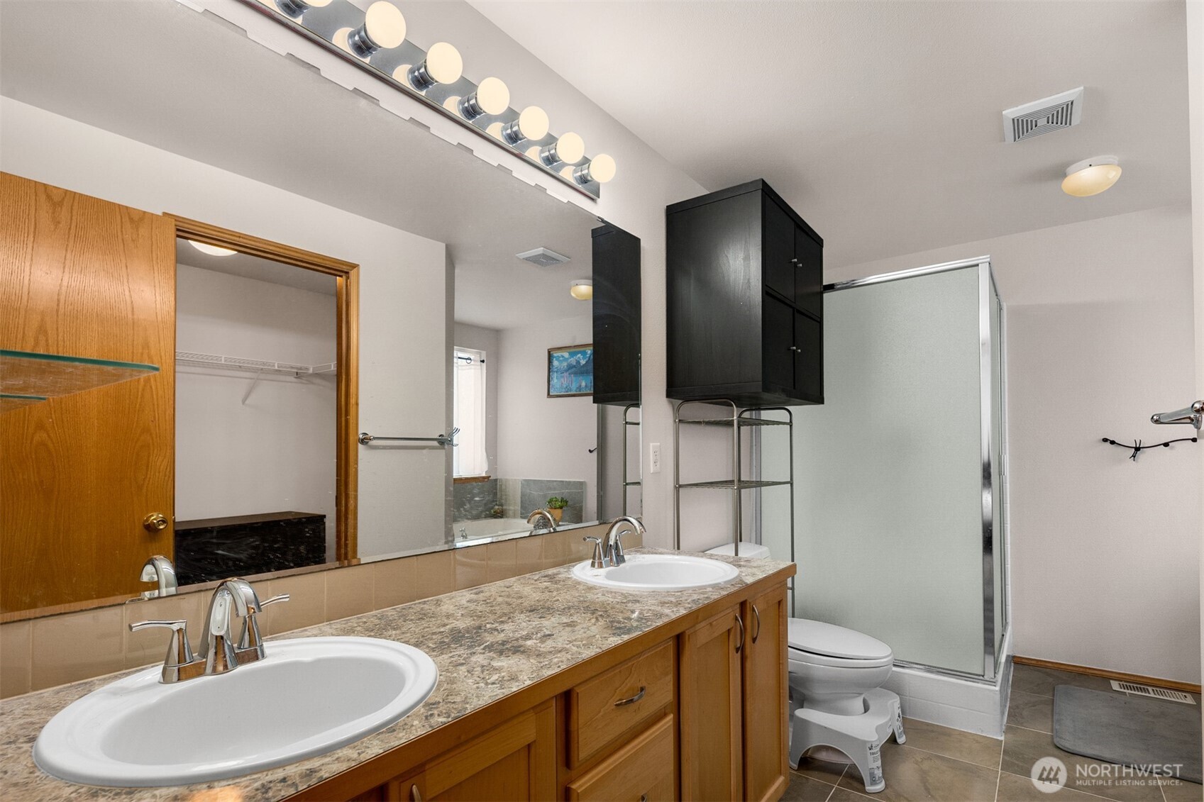 2632 Northeast 24th Court Renton, WA 98056 - Photo 13 of 33 a bathroom with a granite countertop toilet sink and mirror