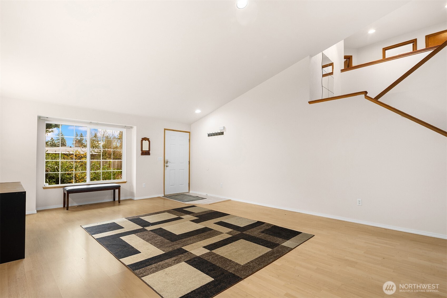 2632 Northeast 24th Court Renton, WA 98056 - Photo 23 of 33 a view of a livingroom with wooden floor and a ceiling fan