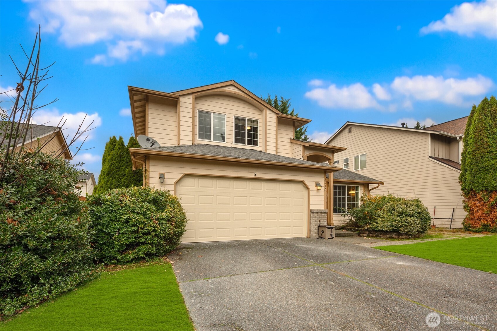 2632 Northeast 24th Court Renton, WA 98056 - Photo 27 of 33 a front view of a house with a yard and garage