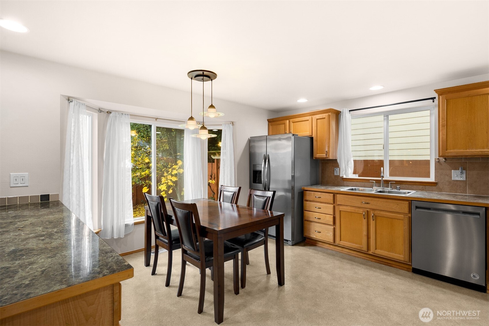 2632 Northeast 24th Court Renton, WA 98056 - Photo 4 of 33 a view of a dining room with furniture window and outside view