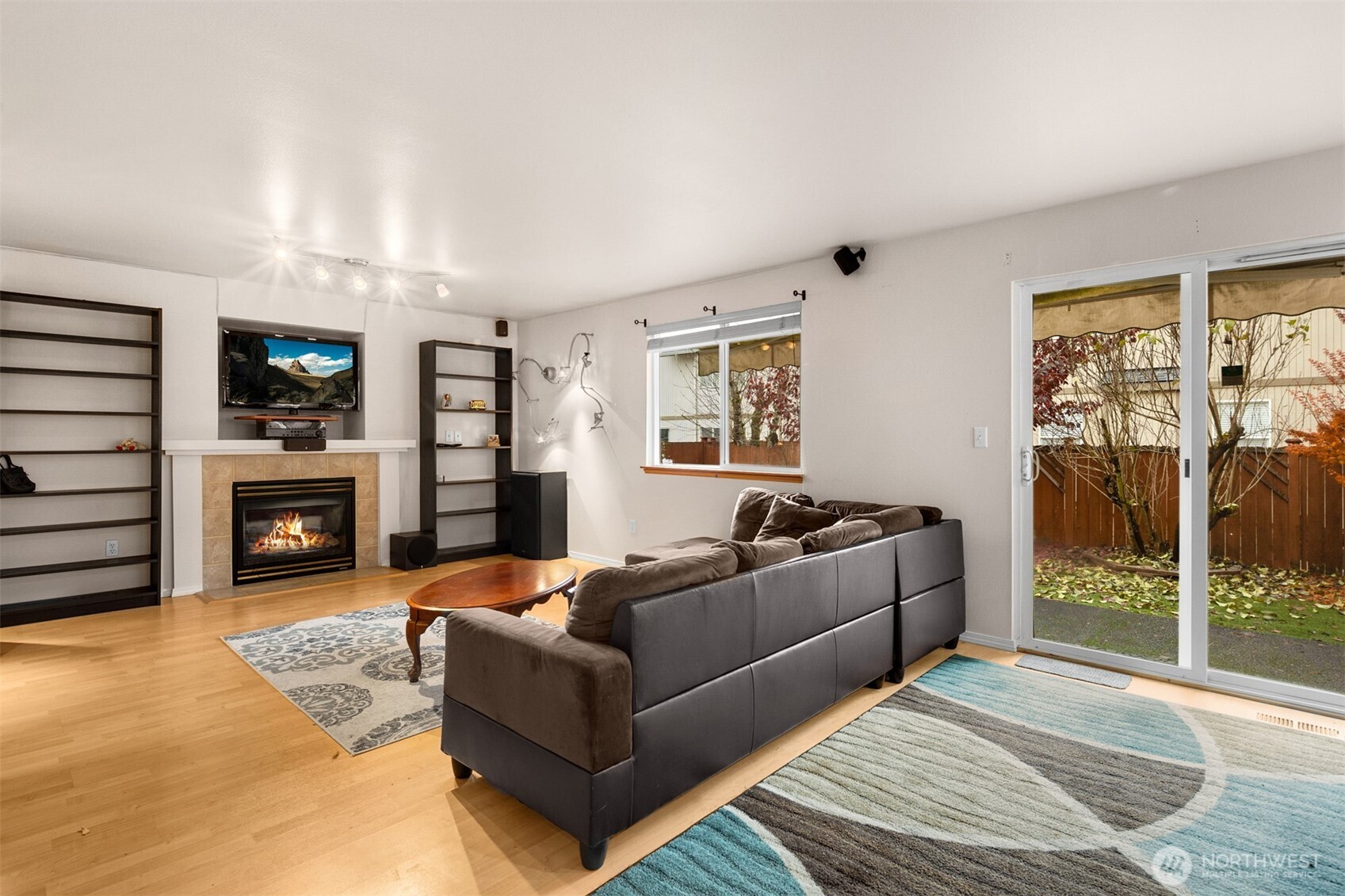 2632 Northeast 24th Court Renton, WA 98056 - Photo 8 of 33 a living room with furniture and a fireplace