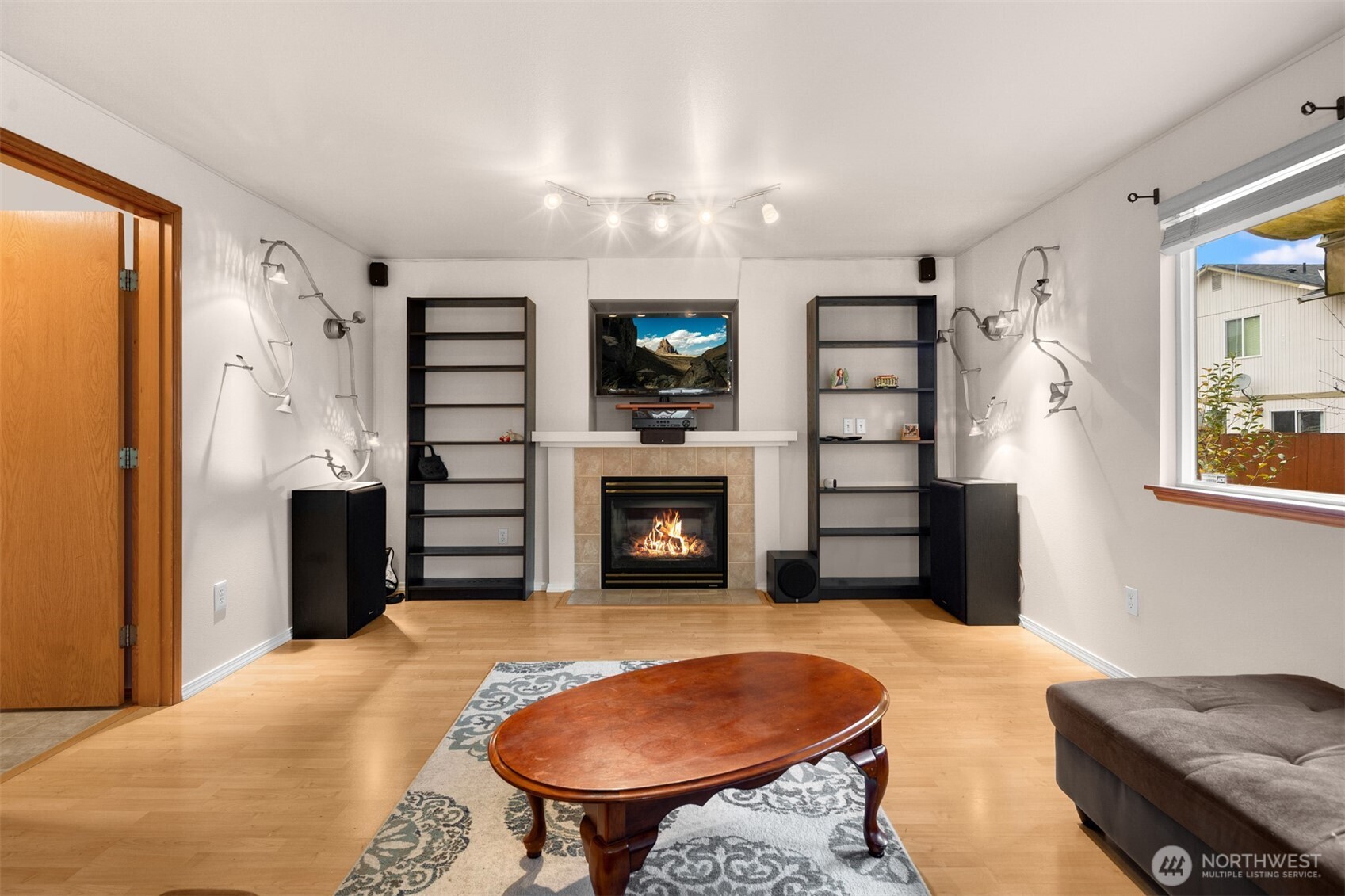 2632 Northeast 24th Court Renton, WA 98056 - Photo 9 of 33 a bedroom with furniture and a fireplace