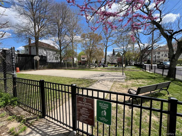 a view of a park with large trees