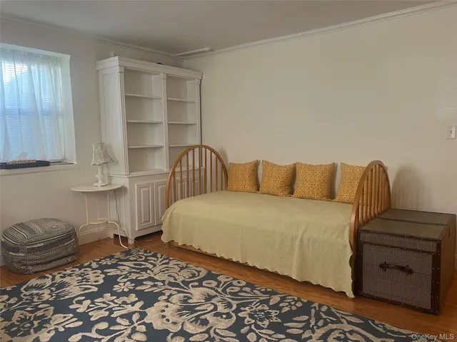 a bedroom with a bed and closet