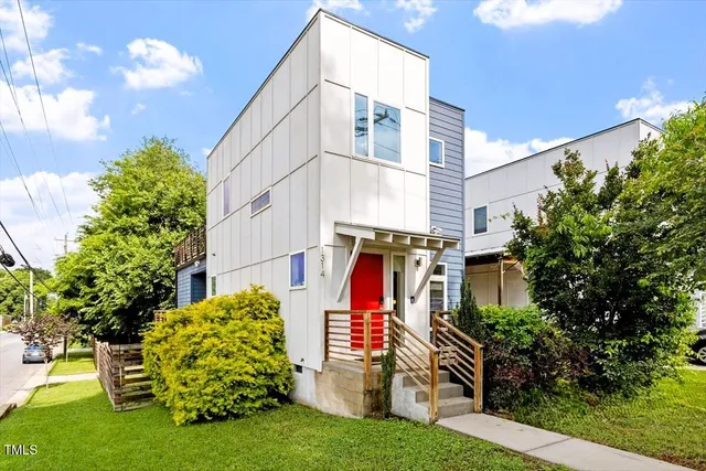 a view of a house with a yard and plants