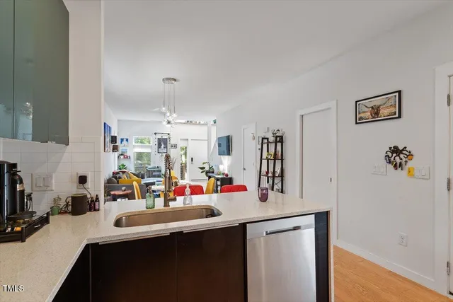 a kitchen with a sink and cabinets