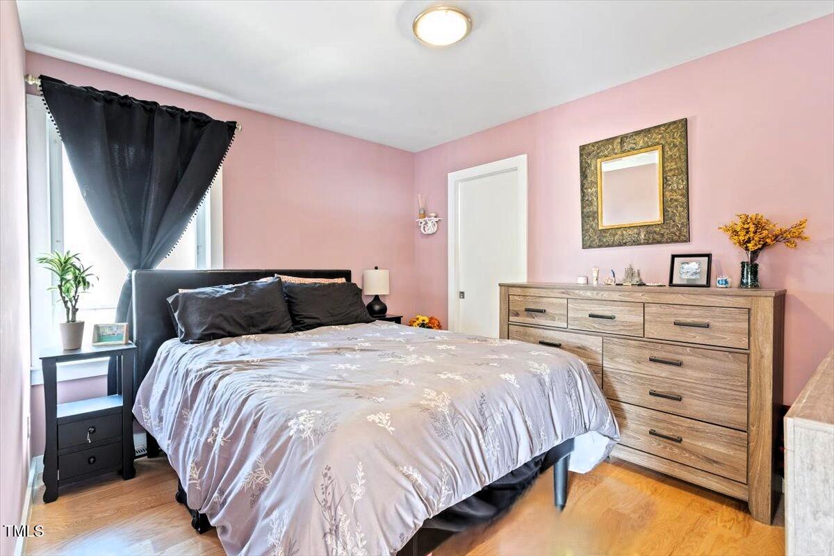 1314 South East Street Raleigh, NC 27601 - Photo 30 of 39 a bedroom with a bed and a window