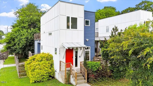 front view of a house with plants
