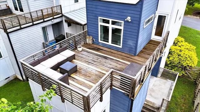 a view of an house with backyard porch and furniture