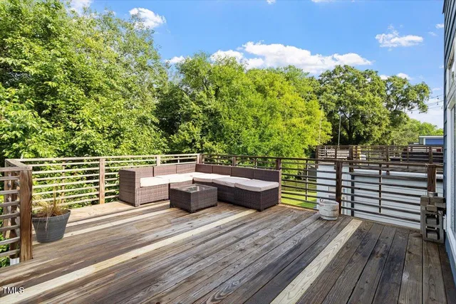 a balcony with wooden floor