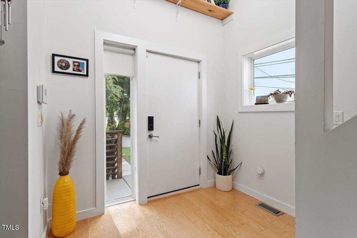 1314 South East Street Raleigh, NC 27601 - Photo 9 of 39 a view of a room with shelves