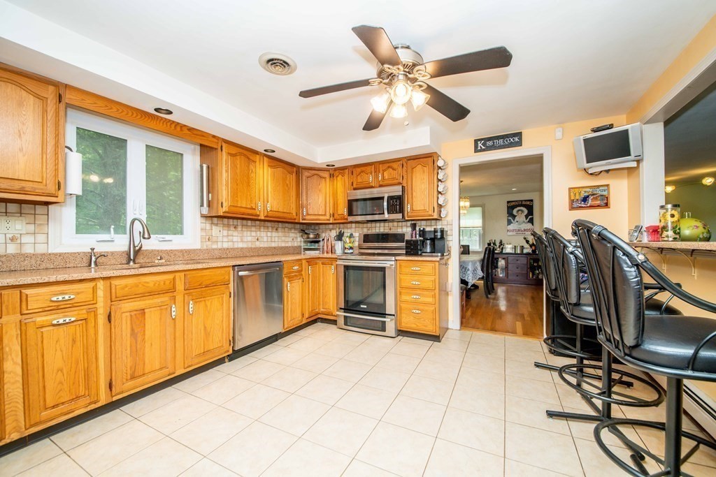 5 Chief Lane Canton, MA 02021 - Photo 11 of 42 a kitchen with cabinets a sink and appliances