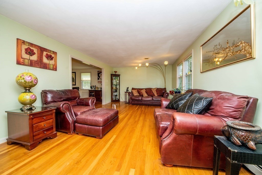 5 Chief Lane Canton, MA 02021 - Photo 14 of 42 a living room with furniture and wooden floor