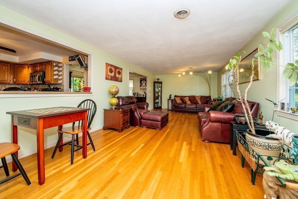 5 Chief Lane Canton, MA 02021 - Photo 15 of 42 a living room with furniture and a flat screen tv