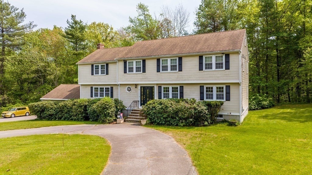 5 Chief Lane Canton, MA 02021 - Photo 2 of 42 a front view of a house with a yard