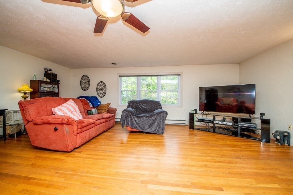 5 Chief Lane Canton, MA 02021 - Photo 25 of 42 a living room with furniture and a flat screen tv