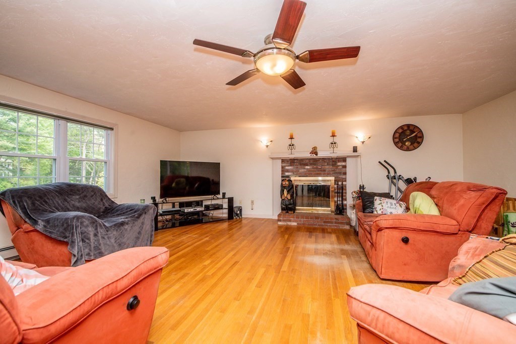 5 Chief Lane Canton, MA 02021 - Photo 26 of 42 a living room with furniture and a flat screen tv