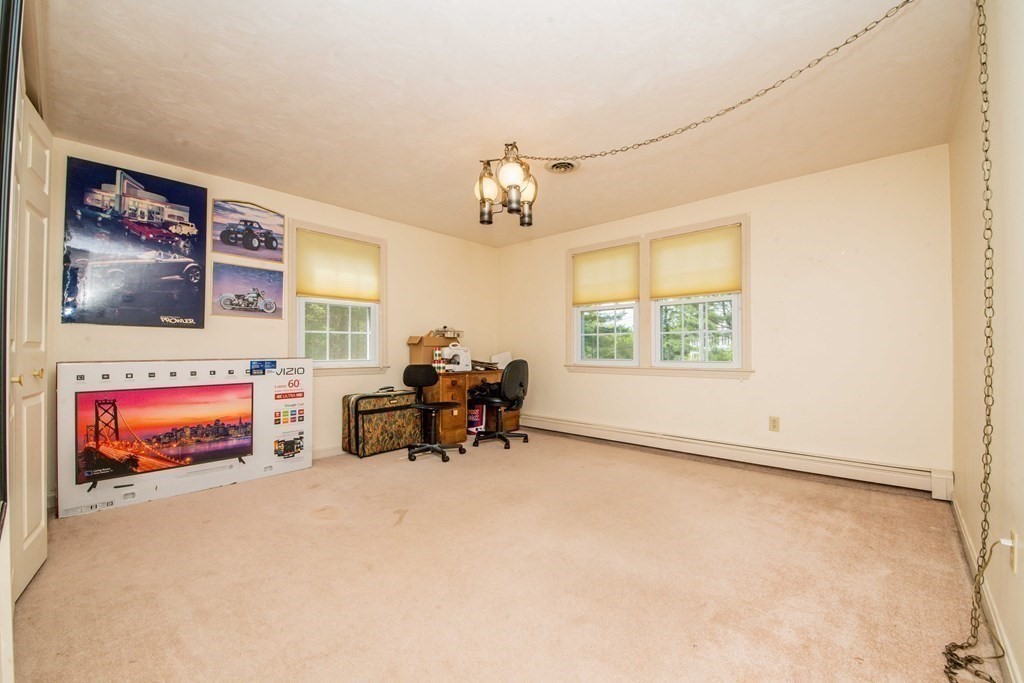 5 Chief Lane Canton, MA 02021 - Photo 33 of 42 an outdoor living room with furniture and a window