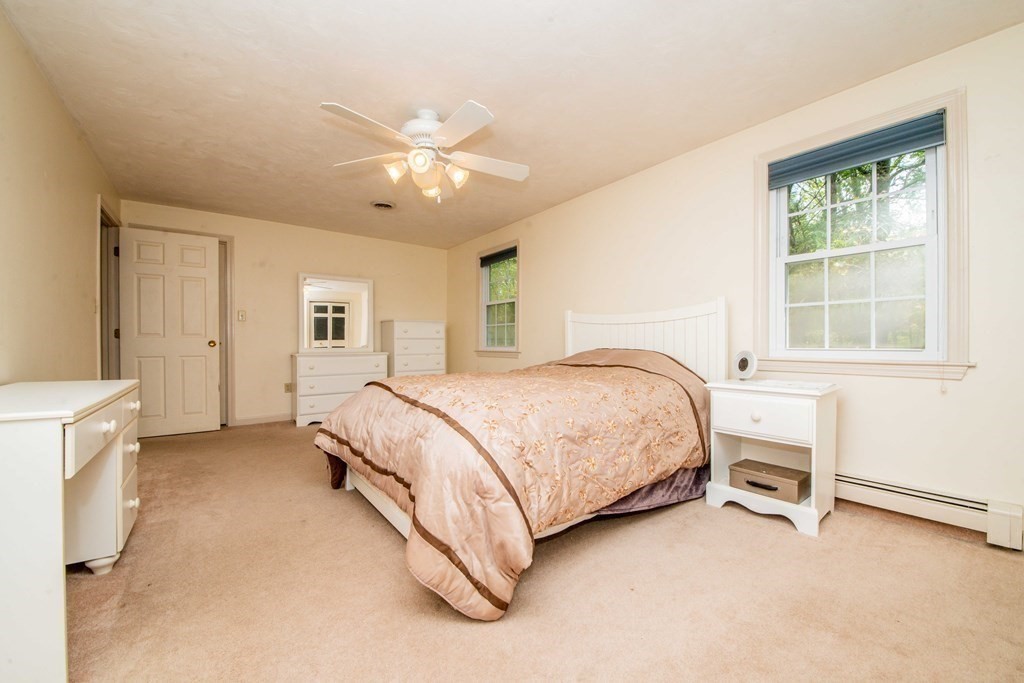 5 Chief Lane Canton, MA 02021 - Photo 34 of 42 a spacious bedroom with a bed and a cabinets