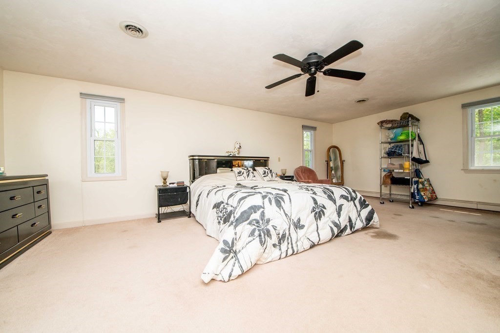 5 Chief Lane Canton, MA 02021 - Photo 38 of 42 a bed room with a bed and a window